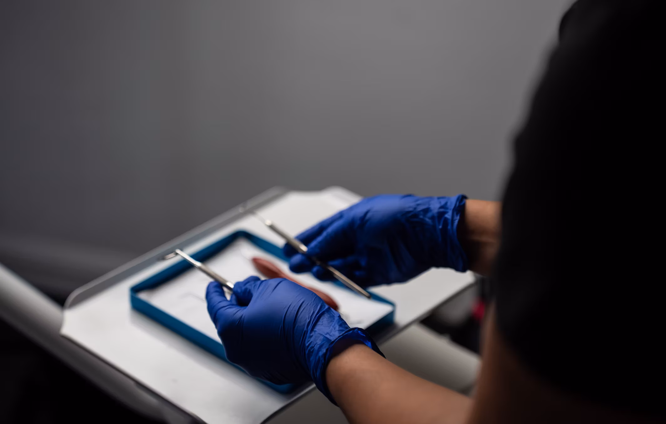 Dentist preparing tools.